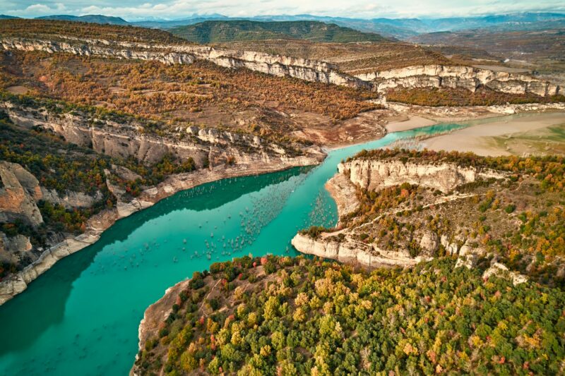 River flowing through mountainous terrain with lush vegetation