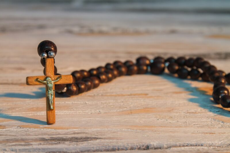 Sacred brown wooden rosary with jesus crucifix.