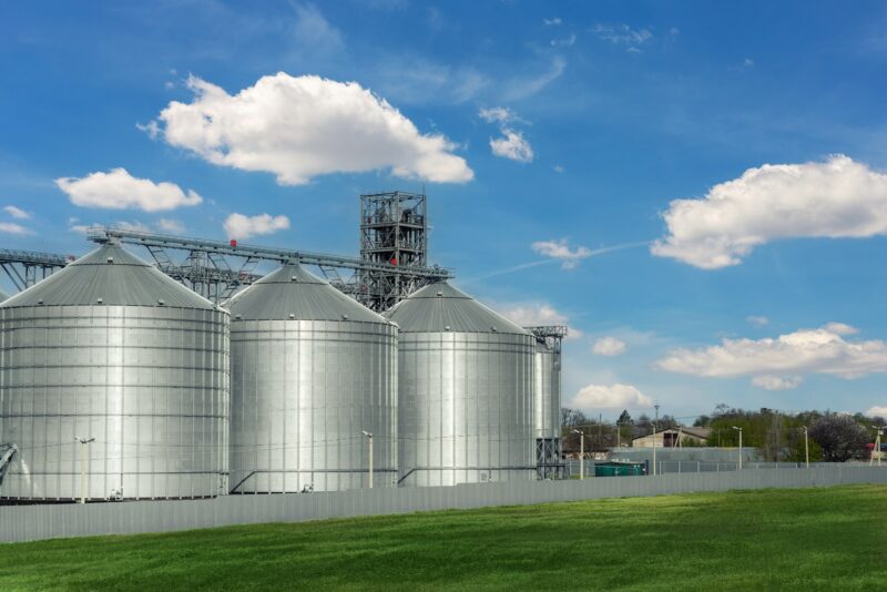 Scenic view of big modern steel agricultural grain granary silos cereal bin storage warehouse