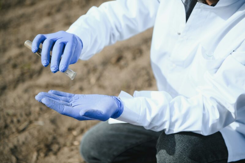 Soil Testing. Agronomy Specialist taking soil sample for fertility analysis.