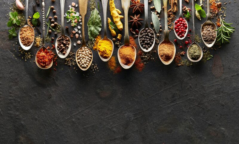 Spices and herbs on graphite board