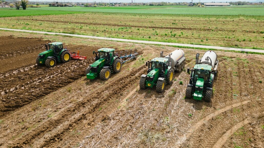 The coordinated work of these four tractors is a testament to the farming industry's ingenuity in