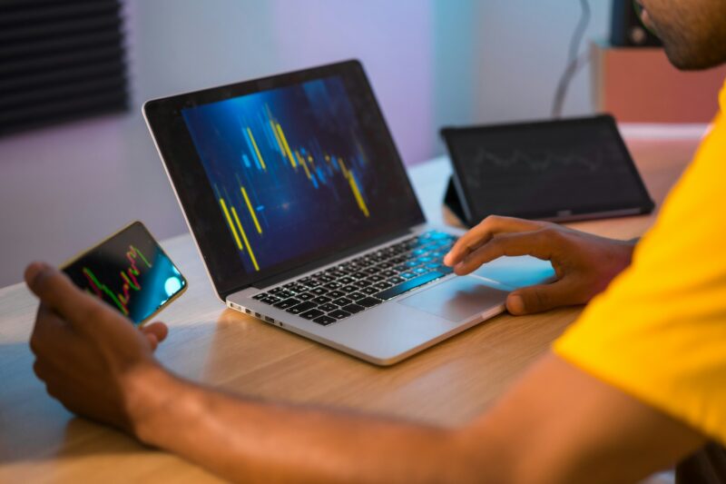 Trader analyzing the data of investment on crypto at home