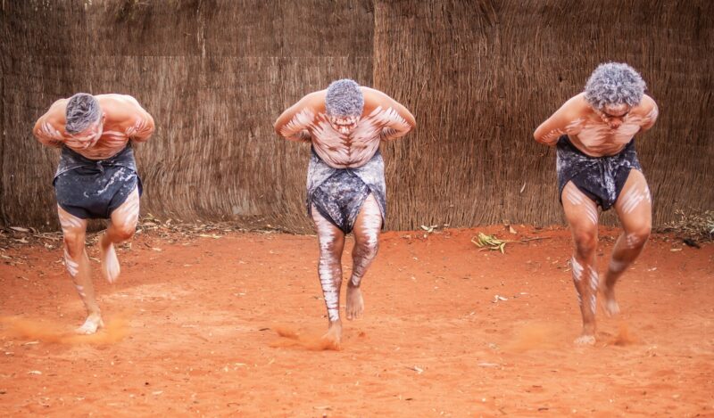 Uluru Outback, Australia - March, 09 2015: Australian aborigines dancing together