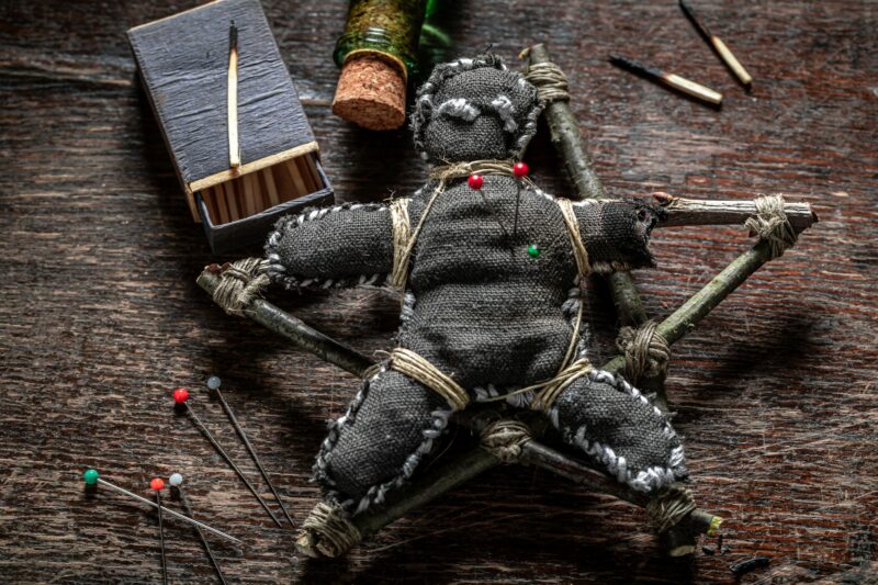 Unique voodoo doll burned with fire as harming