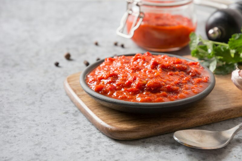 Vegetable ajvar sauce or caviar of baked red bell pepper. Balkan cuisine.