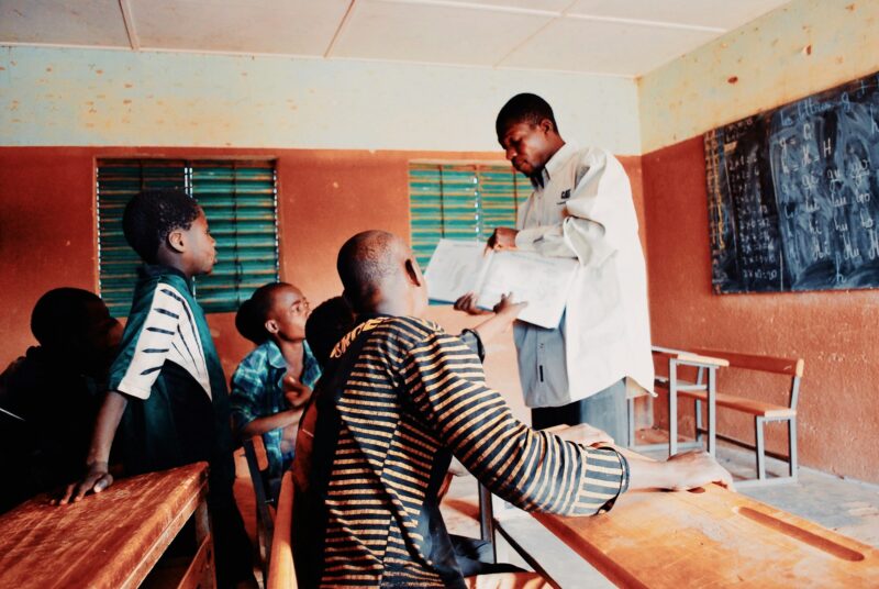 Volunteer teaching healthcare to Street children in Burkina faso