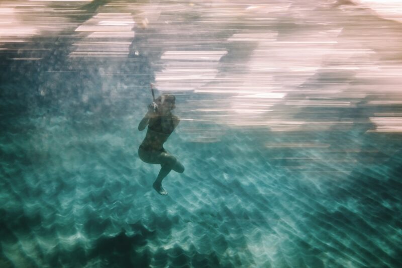 Woman diving underwater for snorkeling