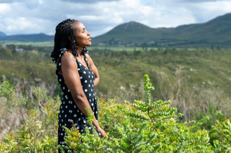 Woman seen standing and soaking in sun