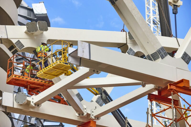 Workers on a construction site. Engineering and architectural infrastructure. Structure