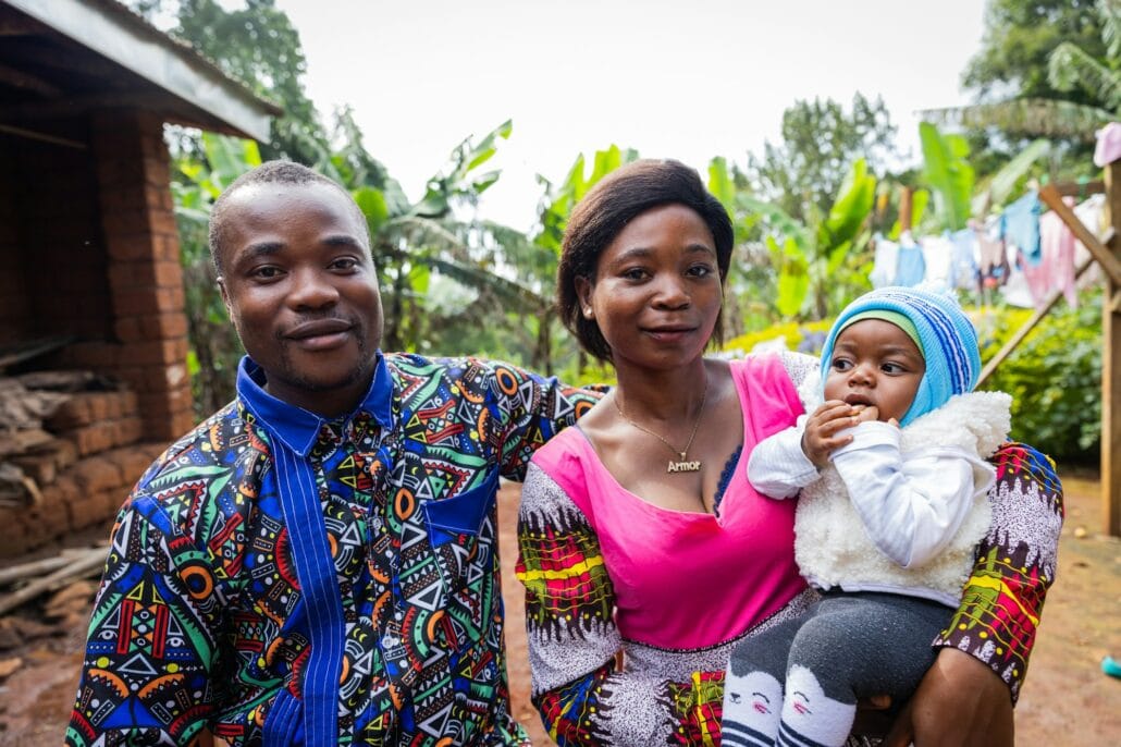 Young African couple with their baby getting some fresh air in the courtyard