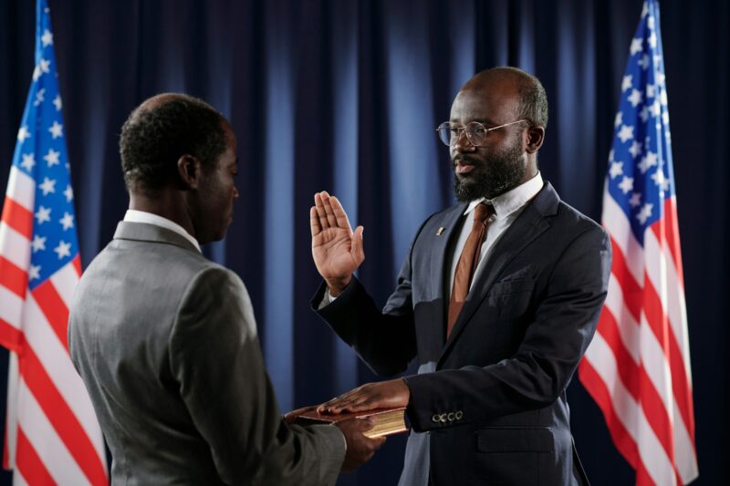 Young confident president of United States giving oath of office