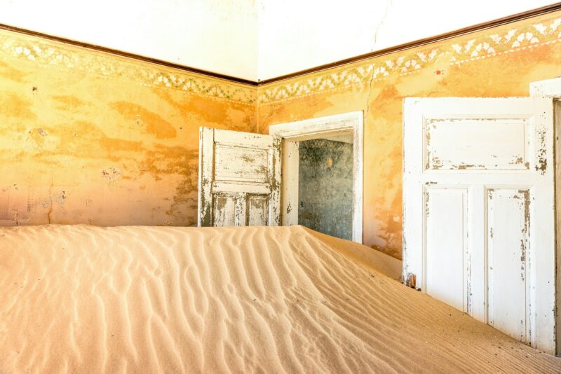 Abandoned house full of sand from the desert in the ghost town of Kolmanskop