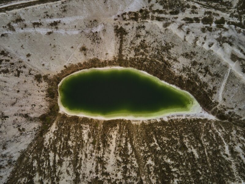 Aerial drone view a green lake formed on phosphogypsum waste