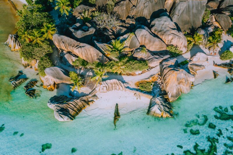 Aerial photo of beautiful famous paradise tropical beach Anse Source D Argent at La Digue island