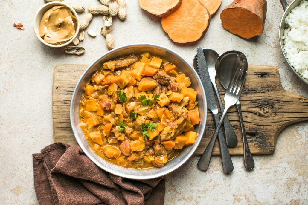 African chicken peanut stew with sweet potatoes with side of basmati rice