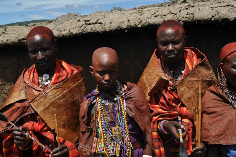 man in red and yellow traditional dress