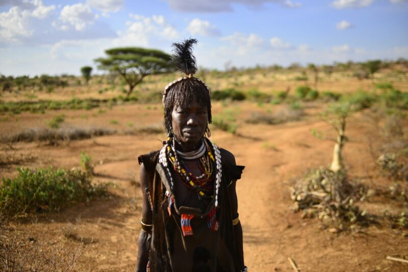 woman standing on open field during daytime