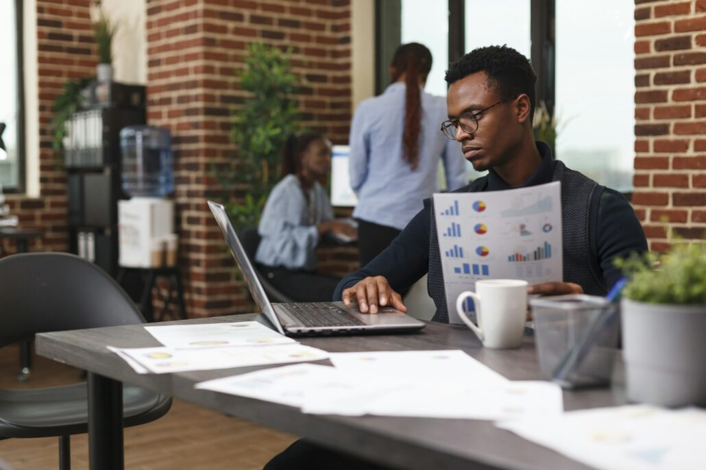 Business company accountant having management chart working on development plan.