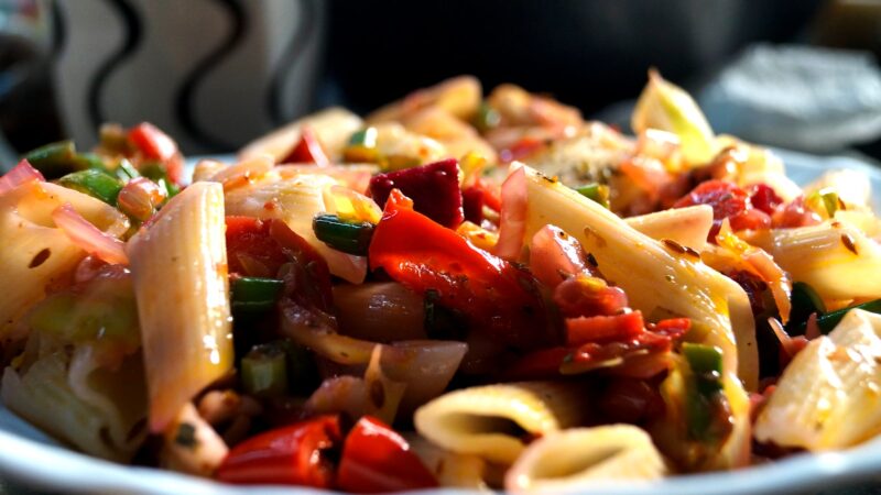 food photography of cooked pasta with slice of ehrbs