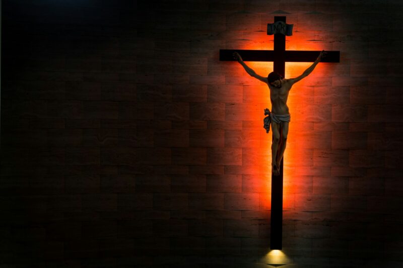 Catholic Christian Crucifix in silhouette flushed right.