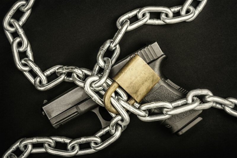 Chained up handgun