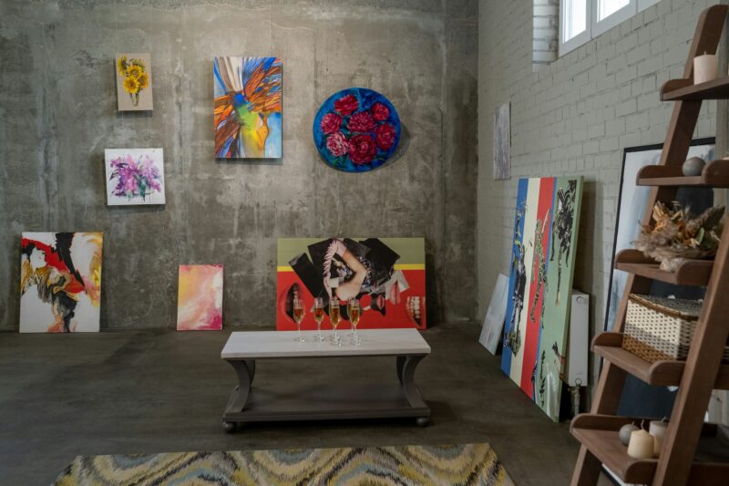 Collection of paintings of modern artists on walls of gallery