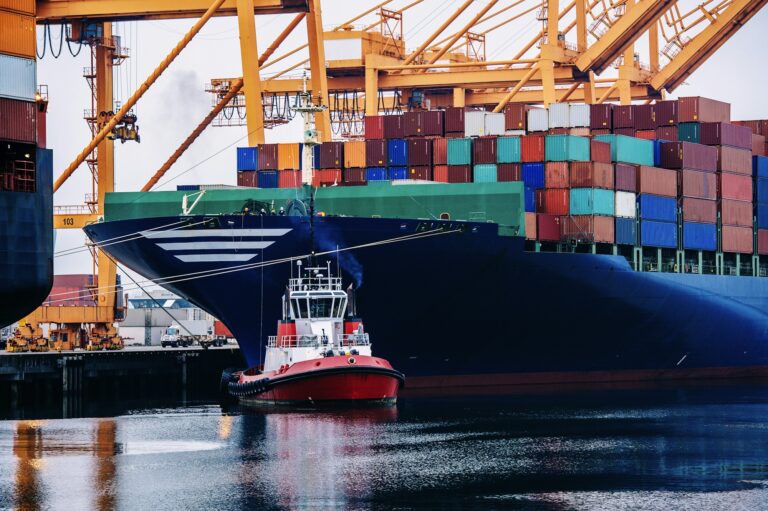 Container ship and tugboat in harbor, Tacoma, Washington, USA