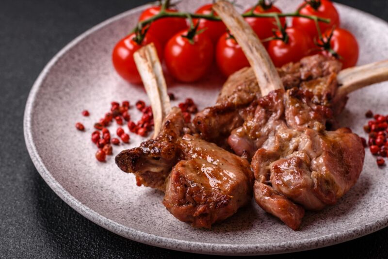 Delicious juicy meat on the bone or rack of lamb or grilled veal