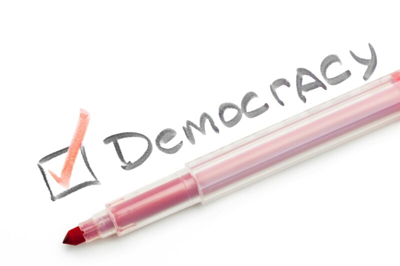 Democracy word drawn by felt tip pen