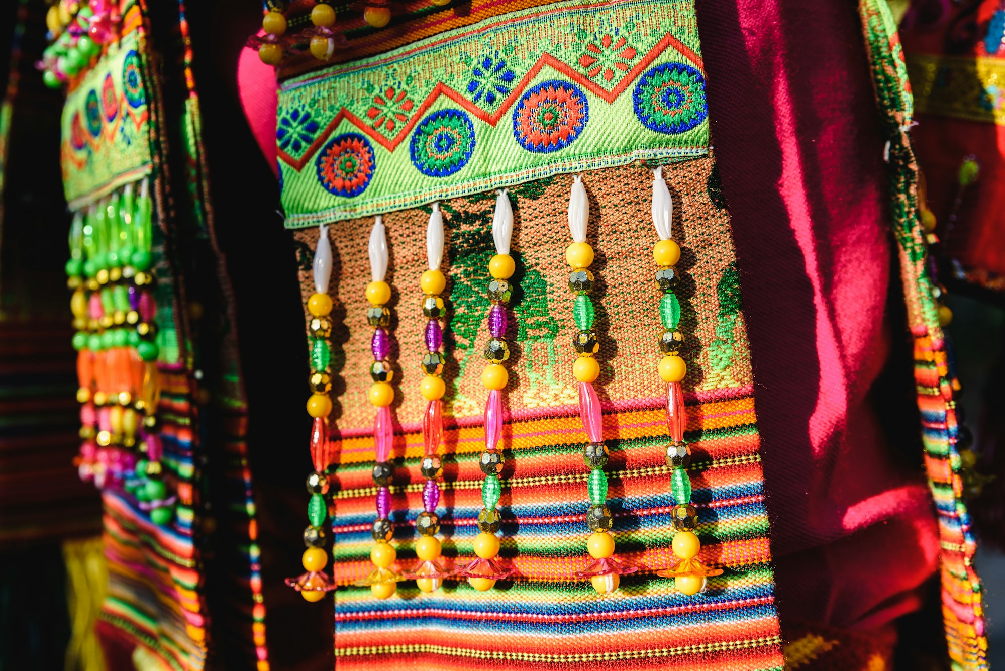 Detail of the colorful embroidery of a typical costume from the Andean folklore of Bolivia