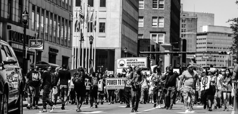 grayscale photo of people walking on street