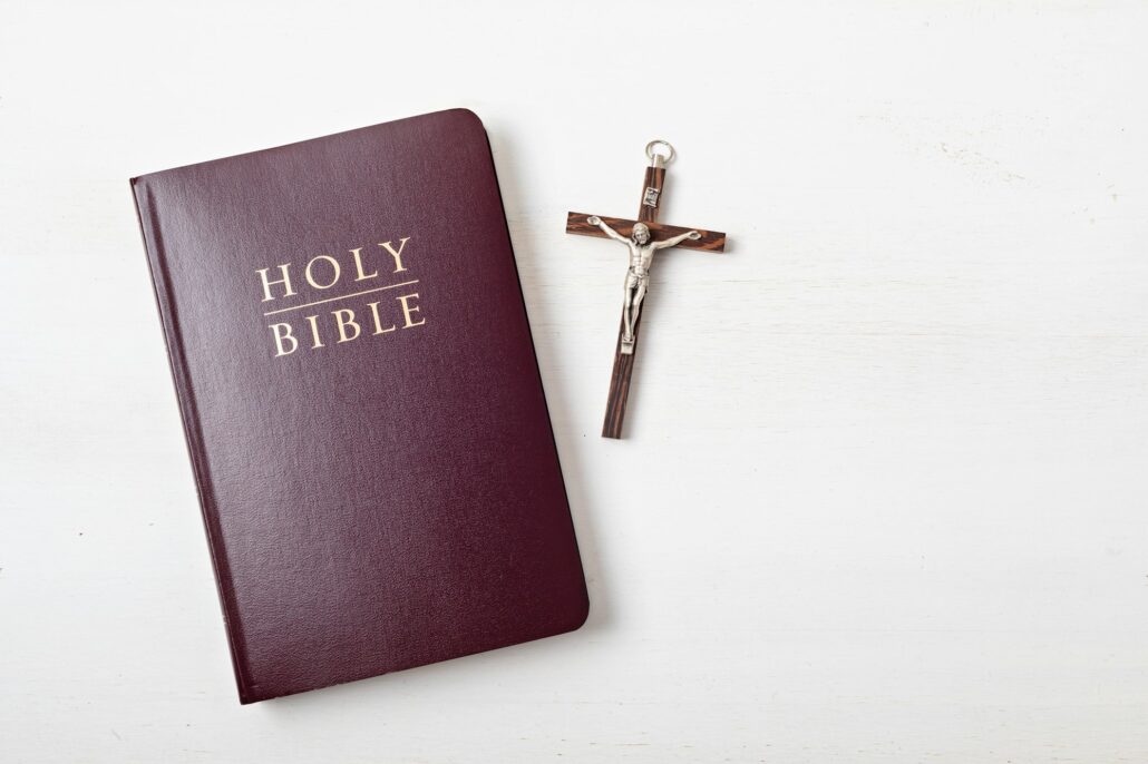 Holy Bible on white wooden table. Christian devotion, Easter celebration
