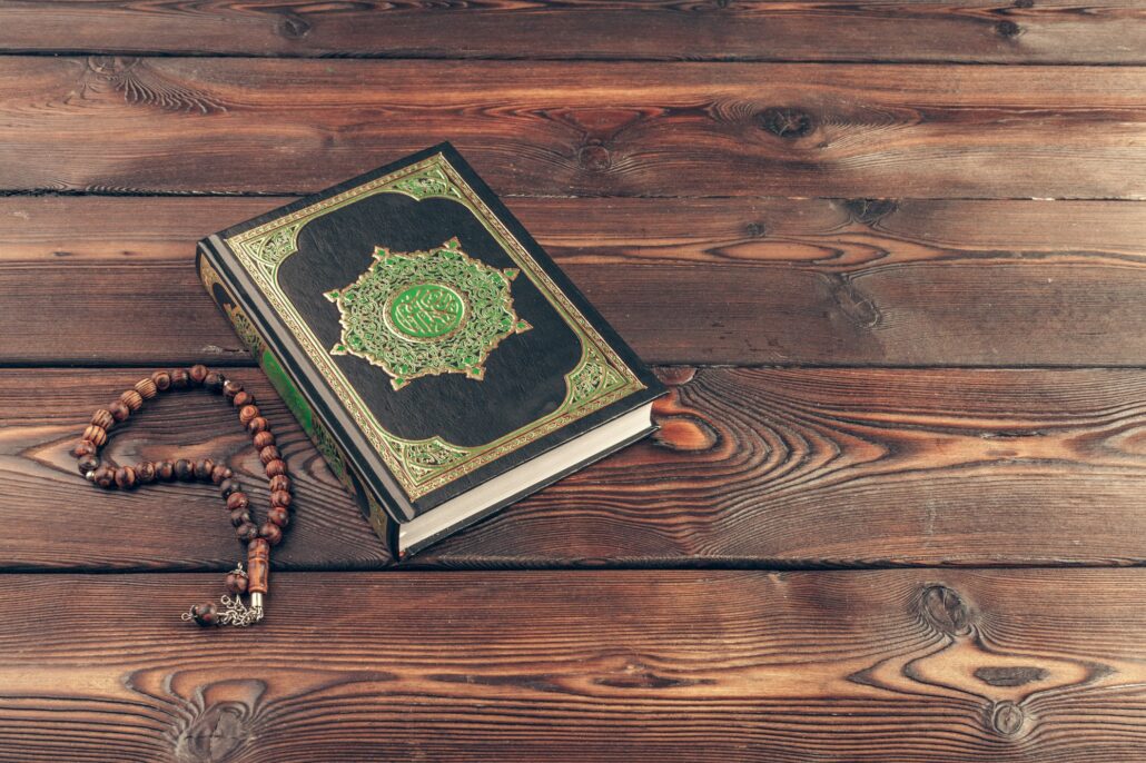 islamic holy book on wooden table