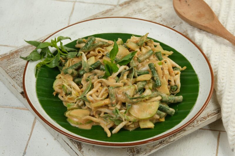Karedok or keredok is raw vegetables salad covered in spicy peanut dressing sauce, The dish can be t