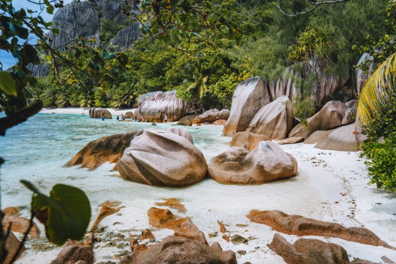 La Digue, Seychelles. Hiking tour around tropical exotic paradise island with granite boulders and