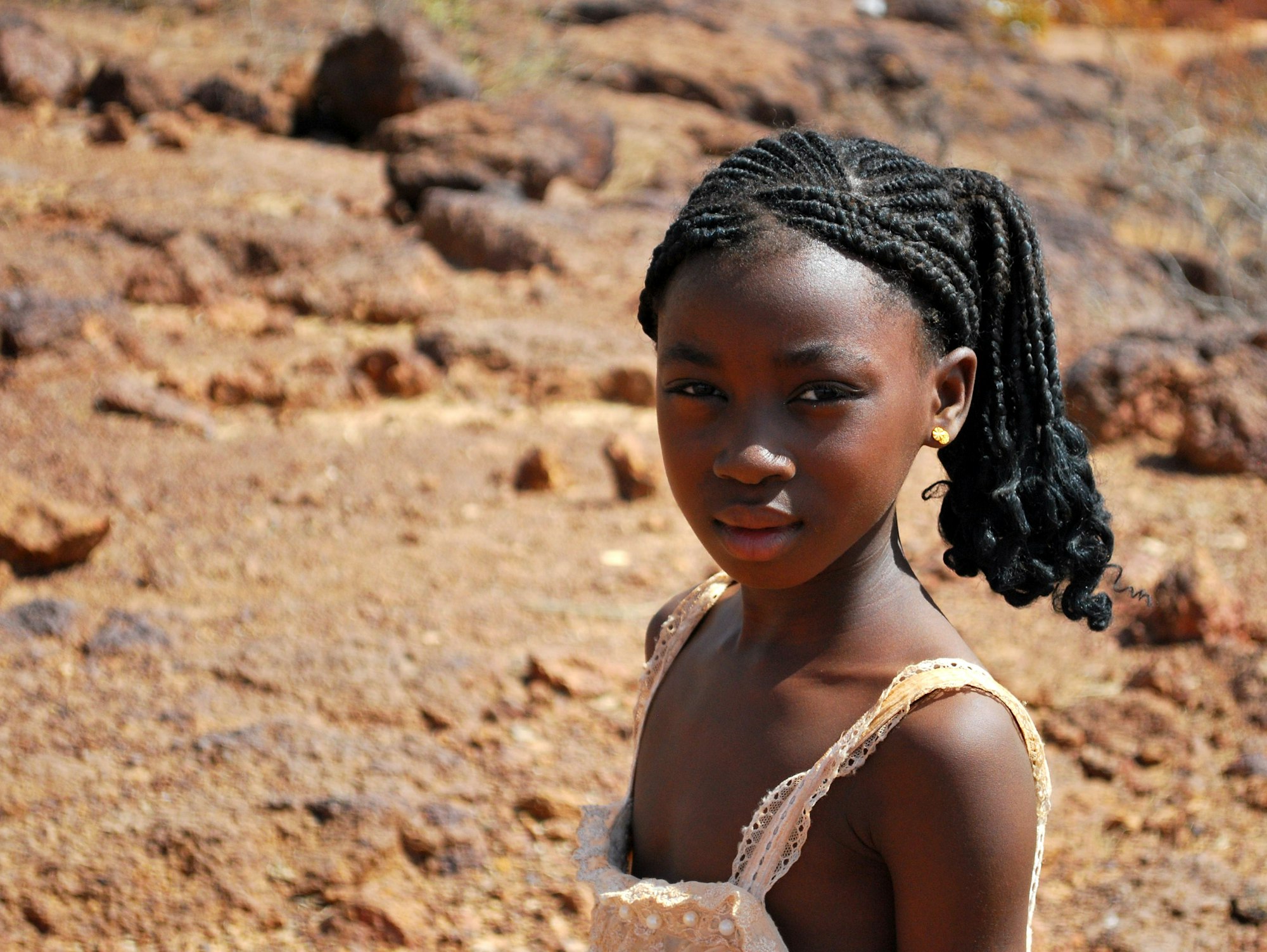 little girl posing for picture in the desert - sand family eyes innocence girl