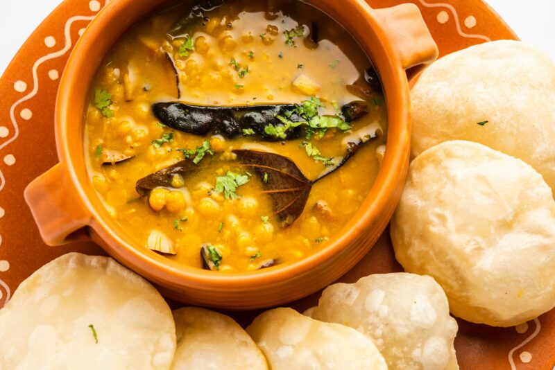 Luchi Cholar Dal or Fried bread made of flour served along with curried Chana or Bengal gram
