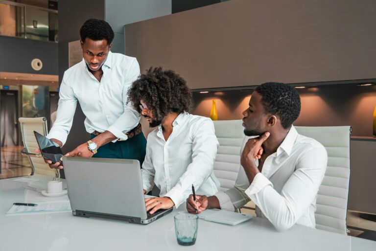 multi ethnic Team analyzing data Development and Discussing Strategy in a Corporate Office