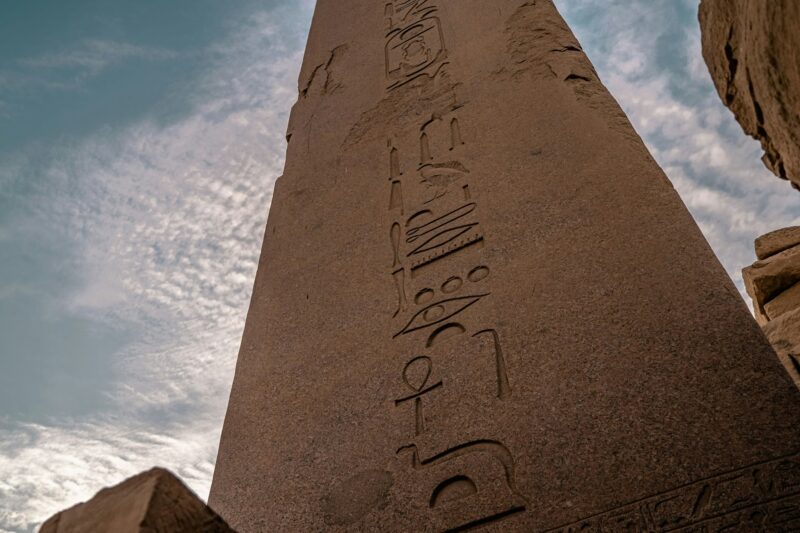 Old pillars and ancient Egyptian drawings on the columns of the Luxor Temple in Egypt,