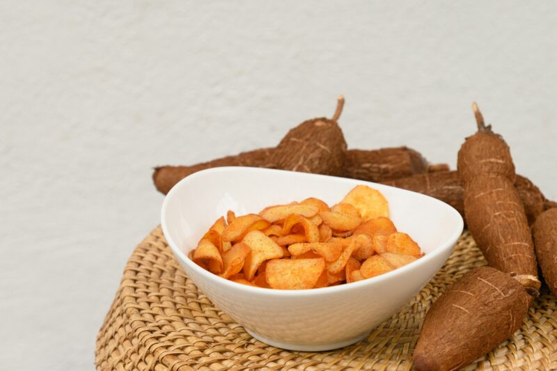 Organic Cassava chips in bowl. Indonesia popular hot spicy snacks. Close up.