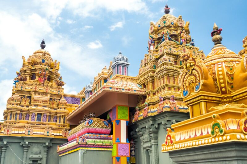 Part of a beautiful and colorful Indian temple in Mauritius Island. Close-up on sculptures and