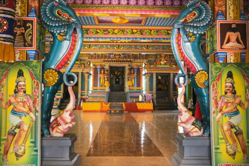 Part of a beautiful and colorful Indian temple in Mauritius Island. Close-up on sculptures and