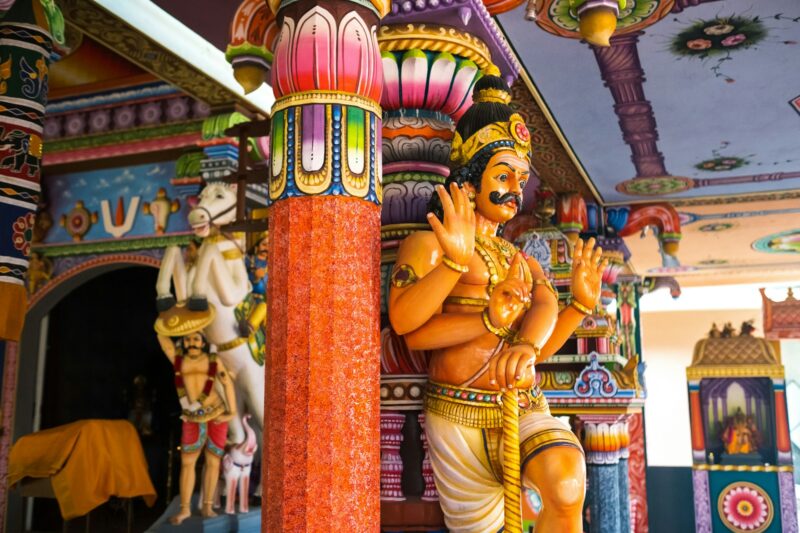 Part of a beautiful and colorful Indian temple in Mauritius Island. Close-up on sculptures and