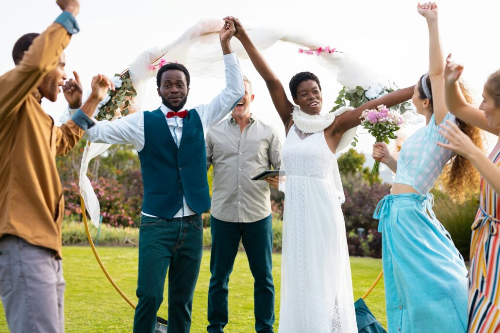 Portrait of happy african american couple holding hands during wedding