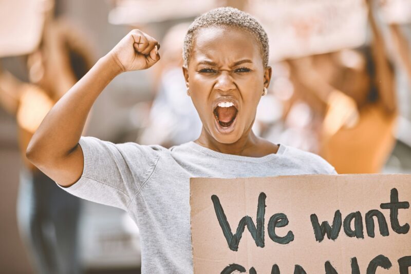 Power, motivation and scream protest of a black woman protesting for social change. Portrait of a y