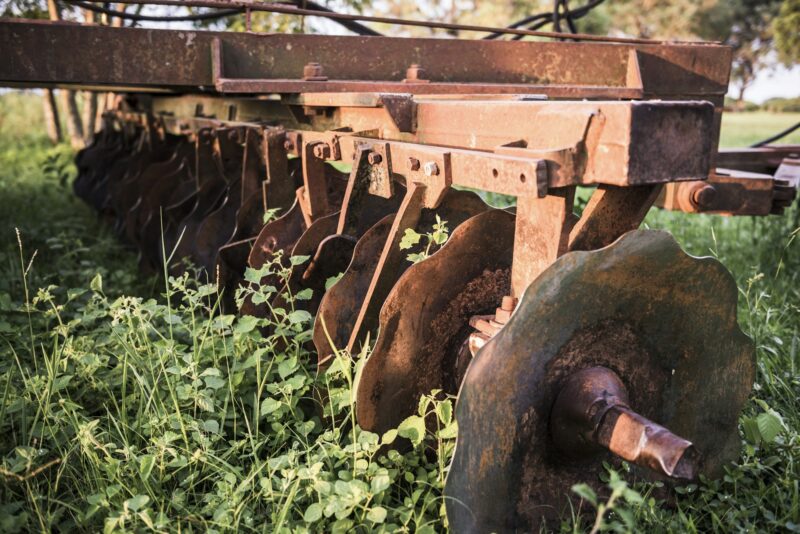 Rusty old farm machinery at Estancia San Juan de Poriahu, a traditional Argentinian cattle farm in t