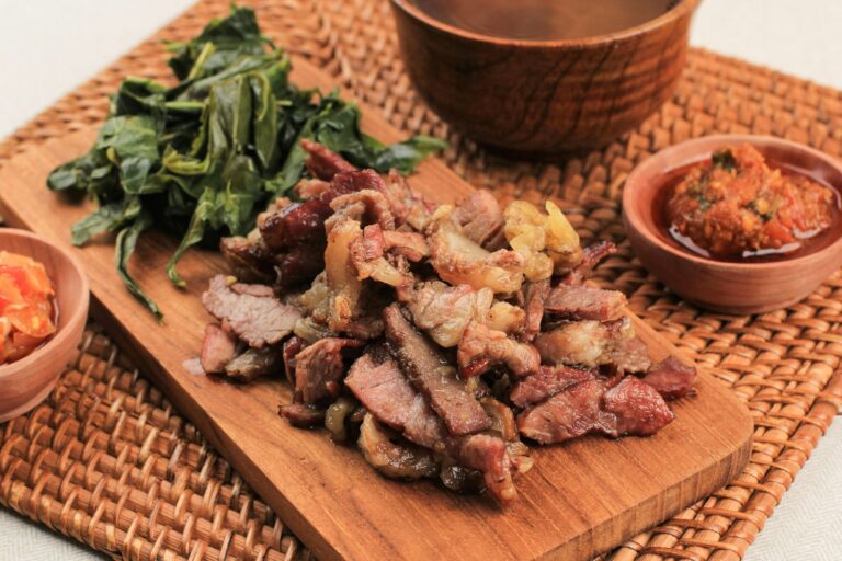 Se'i Sapi or Beef Sei is Indonesia Traditional Smoked Beef, Served with Boiled Cassava Leaves