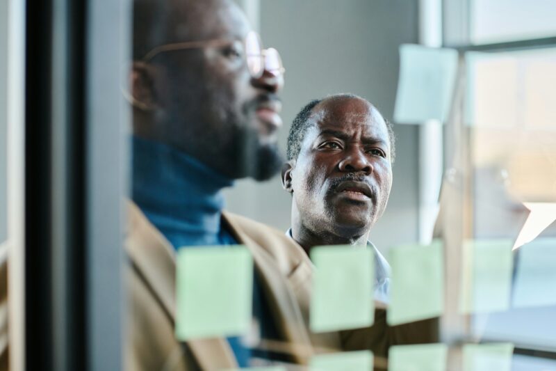 Selective focus on face of mature businessman looking at notes