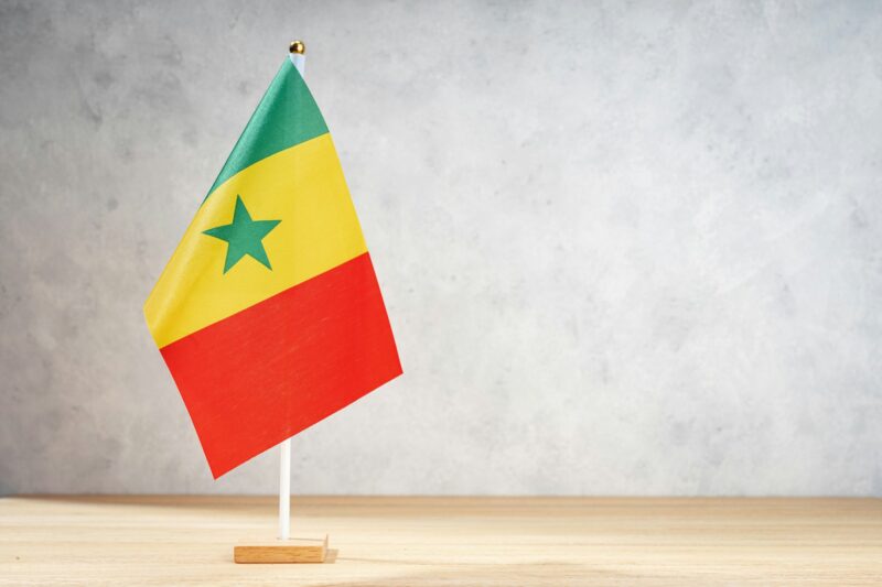 Senegal table flag on white textured wall